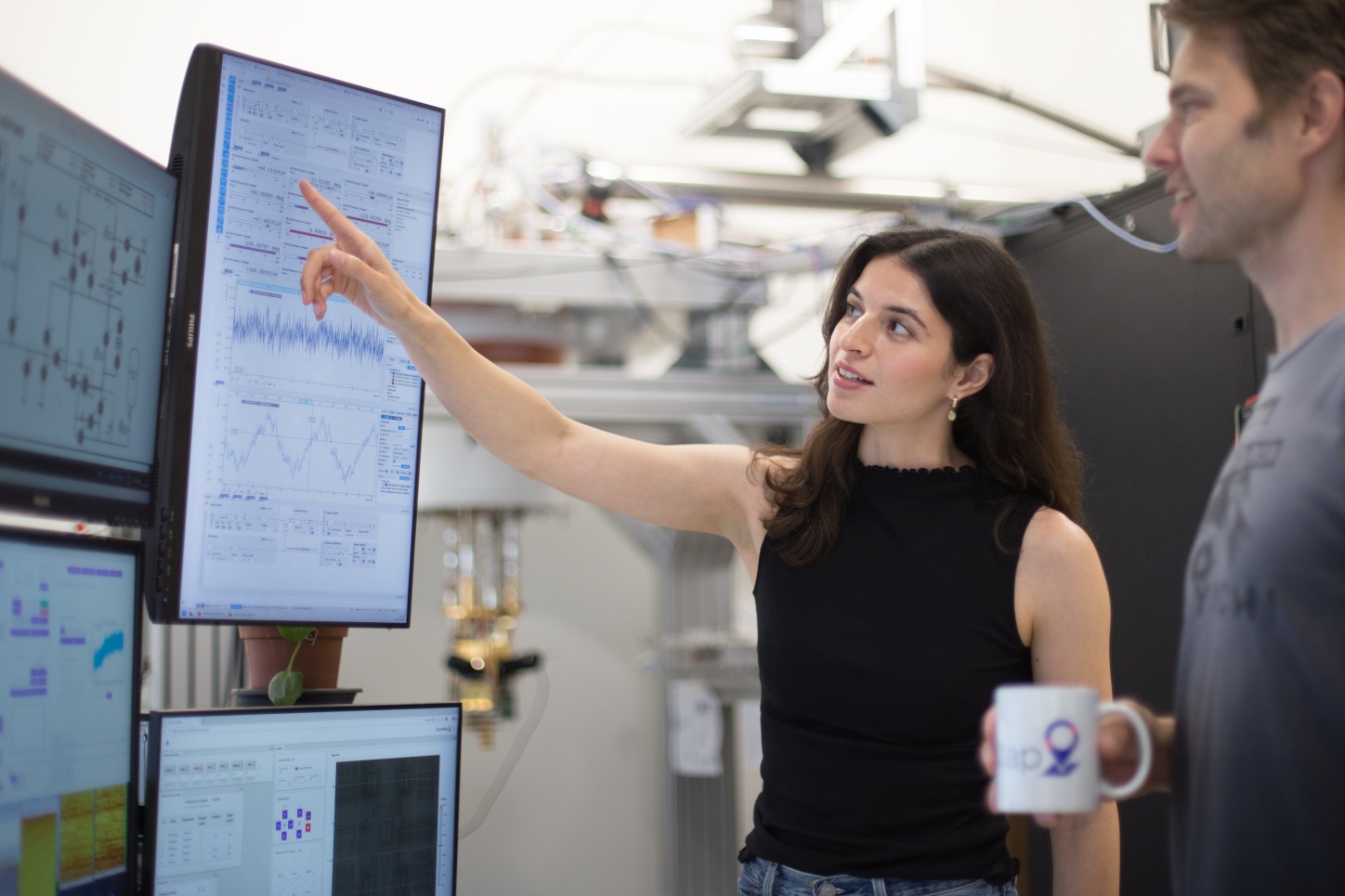 QuantaMap team reviewing scan data on a large display